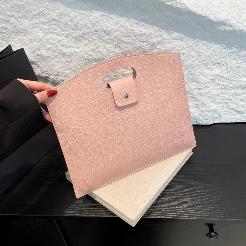 

Office worker handbag book bag portable large capacity simple Korean version commuter bag women 2025 solid color women s bag tide рожевий