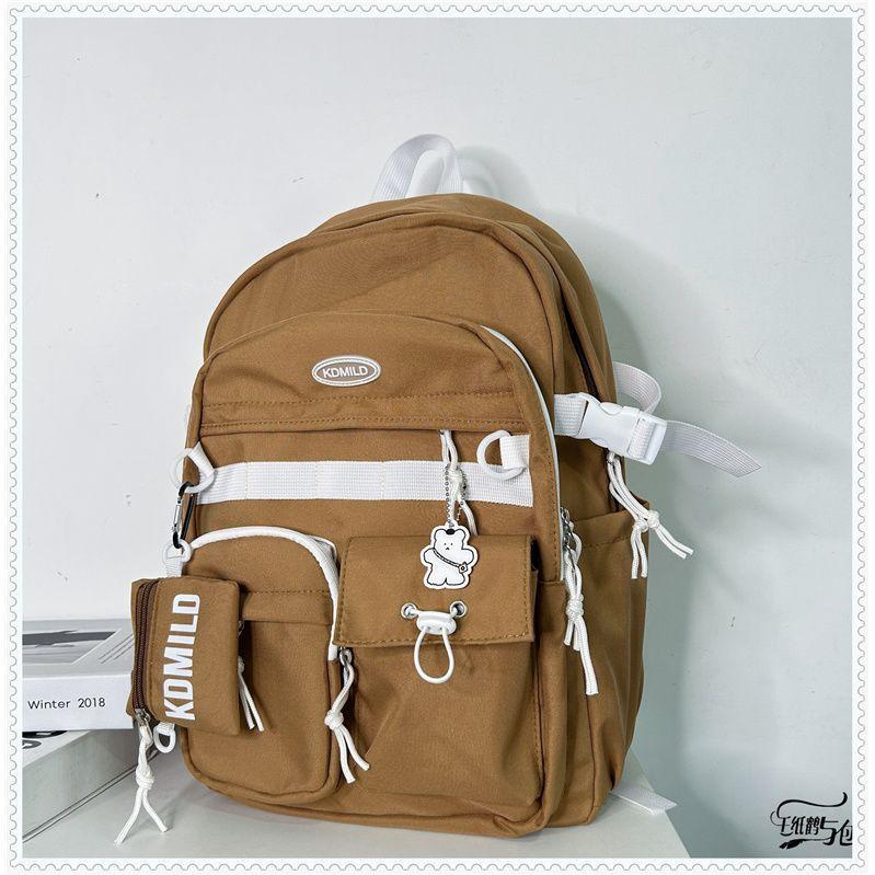 Korean version of versatile tooling style schoolbag female student large capacity Japanese bag travel backpack men and women backpack