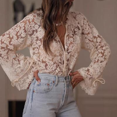Ivory Ruffle Hem Lace Blouse with Tie Cuff Detail