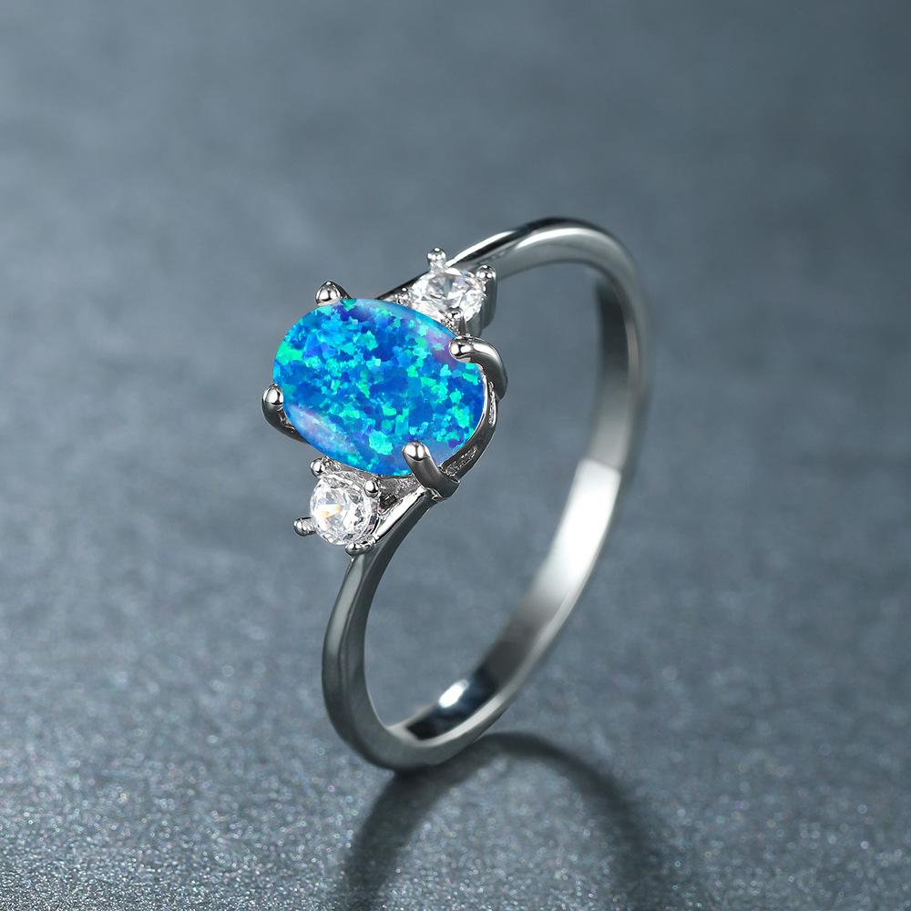 Shein explosion four-claw oval opal edge inlaid with white diamond zircon silver ring female, high-end simple and versatile