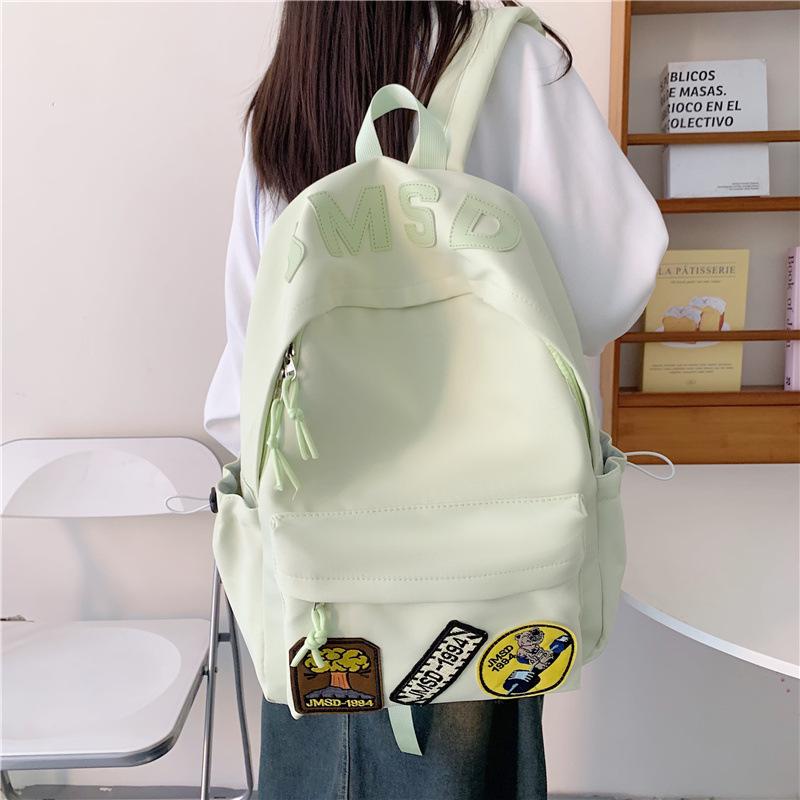 New high-value backpack, junior high school student schoolbag, women's leisure, light commuting, going out for travel, large-capacity backpack.