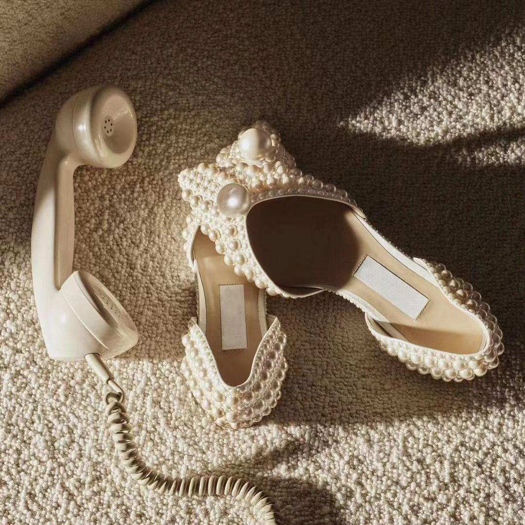 

2025 лето новый темперамент острый нос жемчуг сладкий ветер корень одинарные туфли полые плоские сандалии 43 слоновая кость