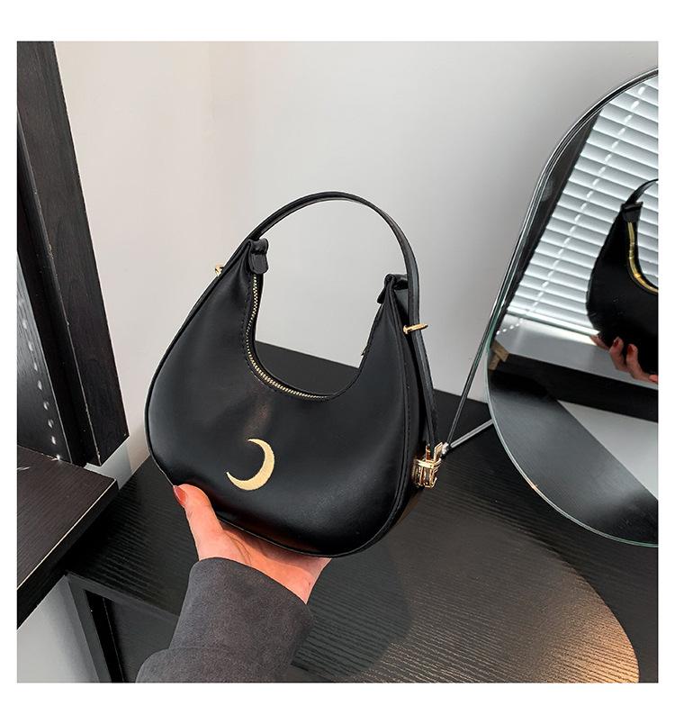 

Нишевая однотонная дизайнерская сумка для женщин 2024 года, новая модная простая персонализированная сумка-полумесяц, персонализированная переносная сумка через плечо чёрный