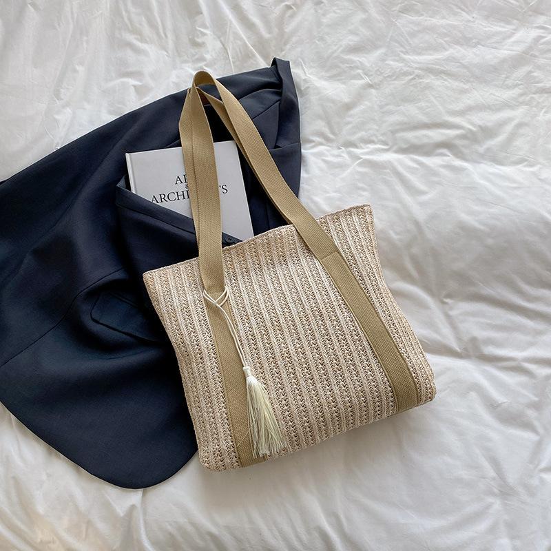 

Summer new hollow commuter weaving 2025 large-capacity straw beach Korean version trendy foreign style shoulder armpit bag хаки