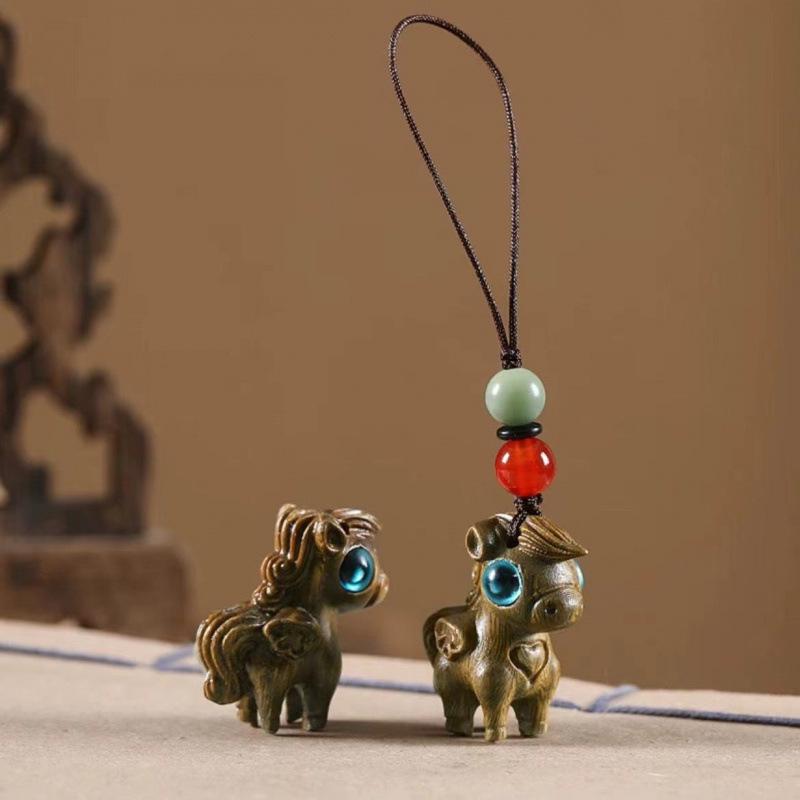 Twelve Zodiac Animal Charms Green Sandalwood Set: Rat, Ox, Tiger, Rabbit, Dragon, Snake, Horse, Sheep, Monkey, Rooster, Dog, Pig.