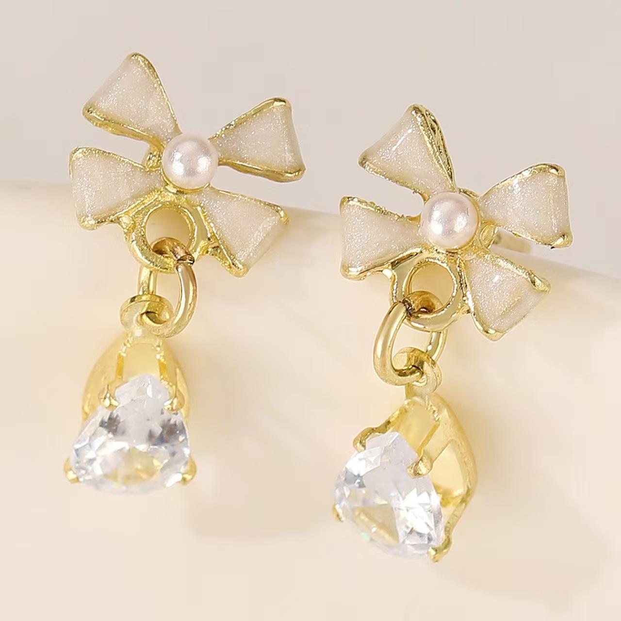 

2025 Light luxury high-end full diamond bow water drop earrings ins temperament versatile Internet celebrity personalized earrings earrings