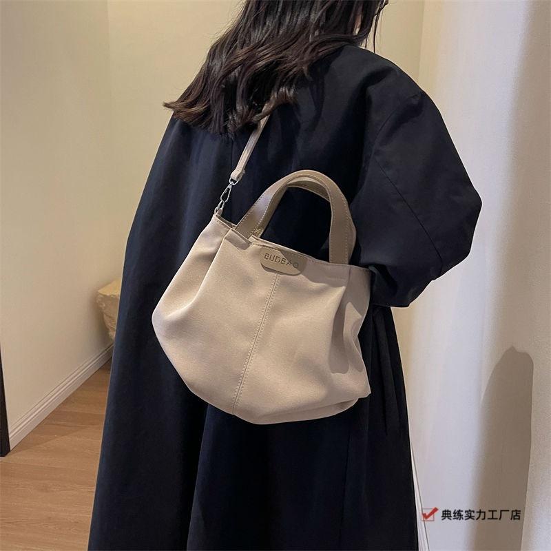 Casual canvas bag women's new versatile simple shoulder handbag fashionable large-capacity student class shoulder bag