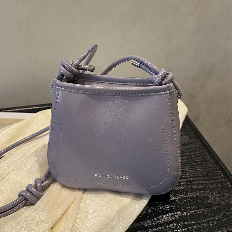 

Versatile texture messenger bucket bag 2025 summer new popular bag women s high-end sense solid color niche shoulder bag фиолетовый