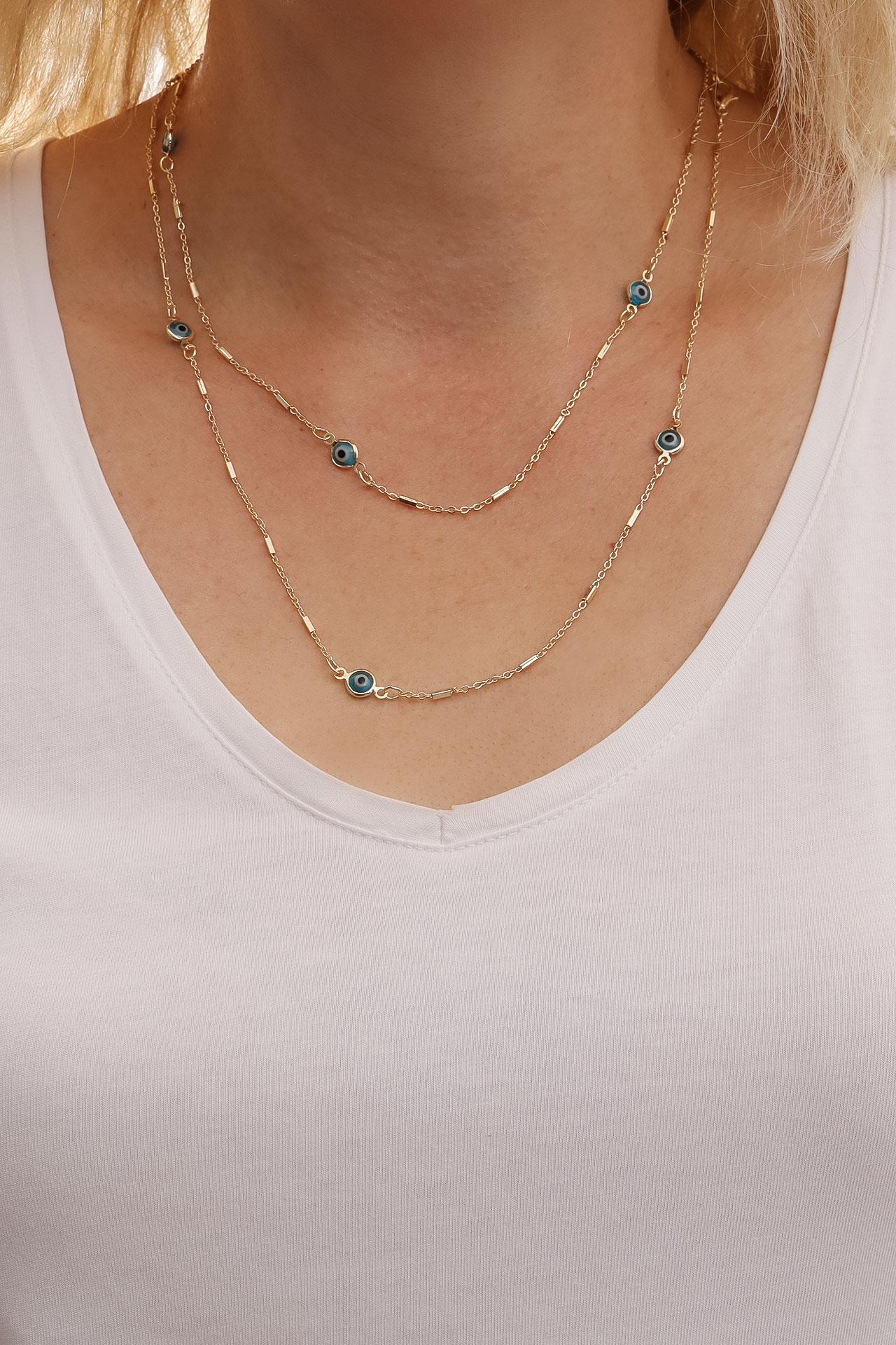 

Длинное синее ожерелье золотого цвета сглаза