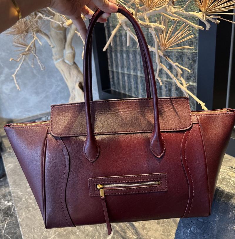 

2025 І Новий Стиль Справжня Шкіра Жіноча Сумка Верхній Шар Коров яча Шкіра Сумка-Посмішка Сумка-Тоут Висококласне Відчуття Велика Місткість Сумка для Рук Одинарна Шкіряна Сумка 33.5x17x21cm вина червоного кольору