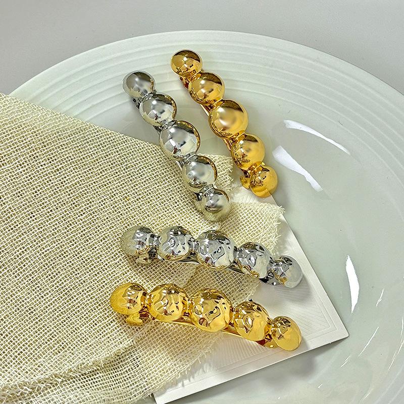 

Elegant Alloy Spring Clip: Shiny Ponytail Hairpin for European & American Styles