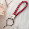 Gevlochten Lederen Touw Sleutelhanger met Poppenhanger - Modieus en Creatief Accessoire