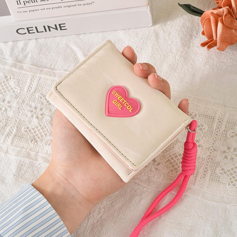 Portafoglio da donna carino a tre ante in pelle PU portamonete compatto con cinturino da polso porta carte multiplo