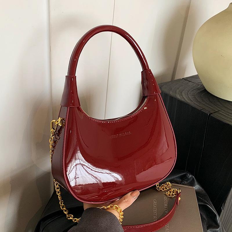 New fashion high-end texture patent leather portable crescent bag temperament light luxury versatile commuter messenger women's bag
