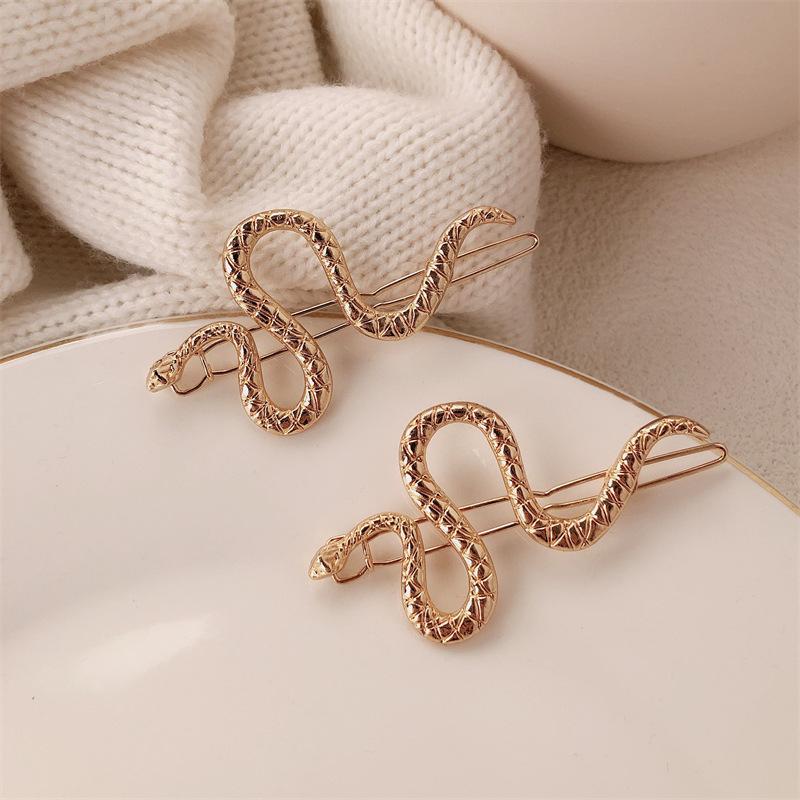 

2 ШТ Нові Унікальні Заколки для Волос у Формі Змії - Трендові Бічні Шпильки для Жінок, Креативні Затискачі для Чубчика з Мінімалістичним Дизайном 2PCS золотий