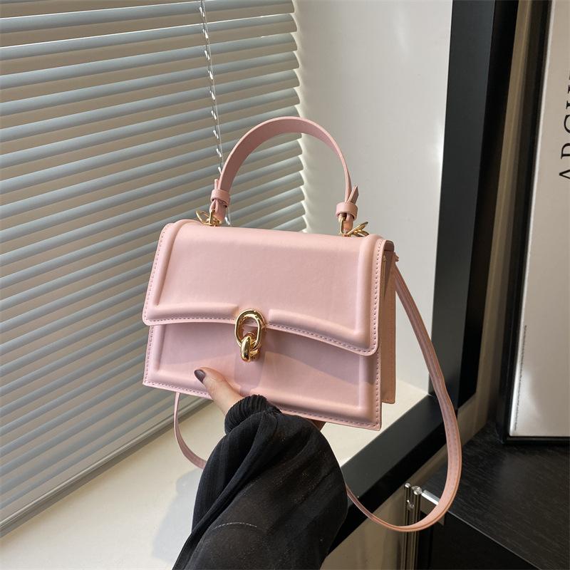 Hand carry small bag women's new 2025 solid color texture handbag foreign style simple messenger small square bag