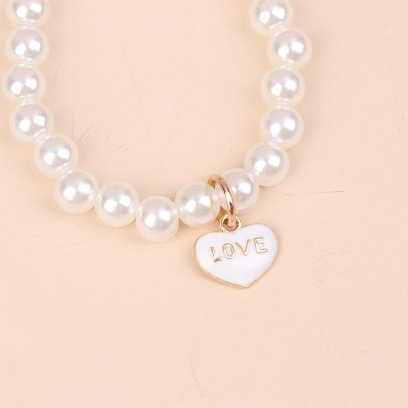 

Bow Eternal Flower Pearl Chain Keychain Creative Rose Car Key Chain Bag Pendant Gift as the picture