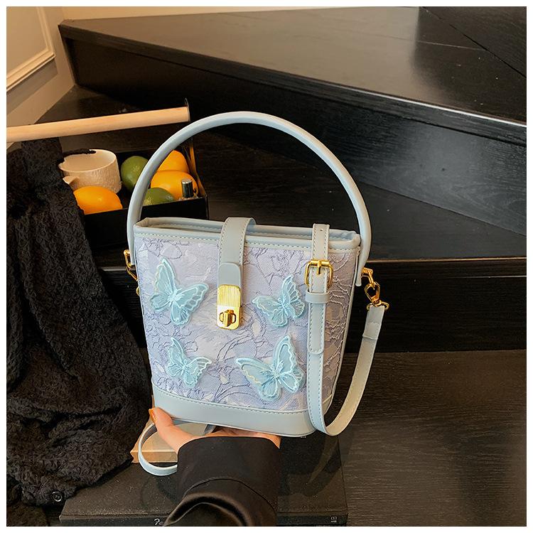 New small bag women 2025 fashion cartoon portable bucket bag versatile texture messenger bag