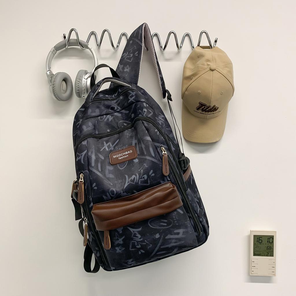 Schoolbag new graffiti niche schoolbag male junior high school student high school student lightweight backpack college student large capacity