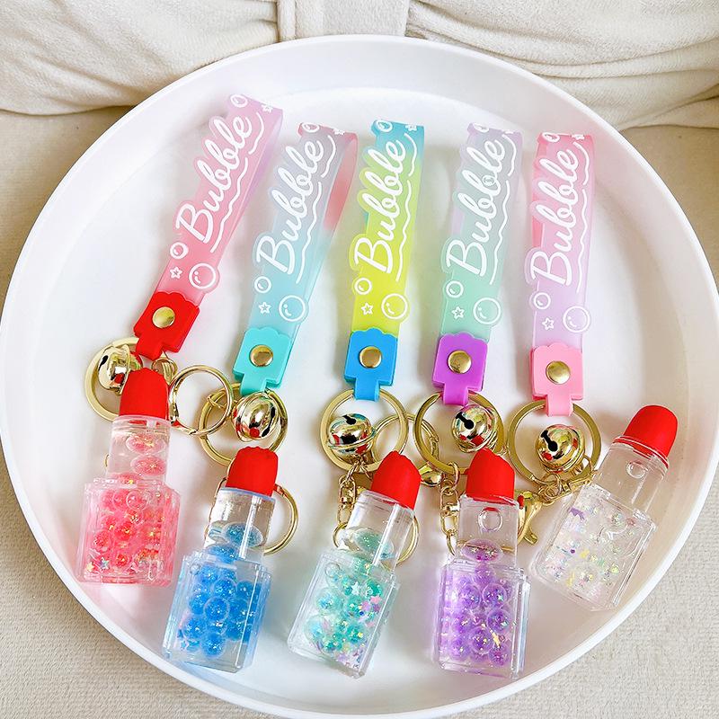 Luminous Bubble Bead Lipstick Keychain: Cute Liquid Quicksand Fashion Pendant.