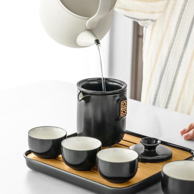 Portable four-load ceramic travel kung fu tea set, one pot and four cups of ceramic simple gift box, gift set