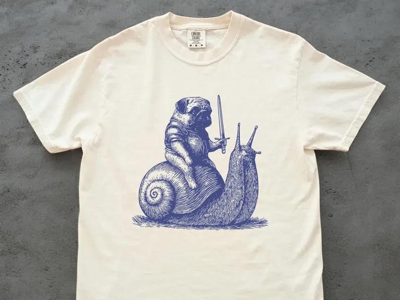 

Medieval Pug Knight Riding Snail Vintage Tshirt Funny Dog Meme Retro Creepy Unisex T-Shirt S