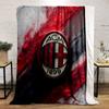 Red and black textured diagonal streaks with a central oval emblem. for all seasons blanket lunch break throw gift