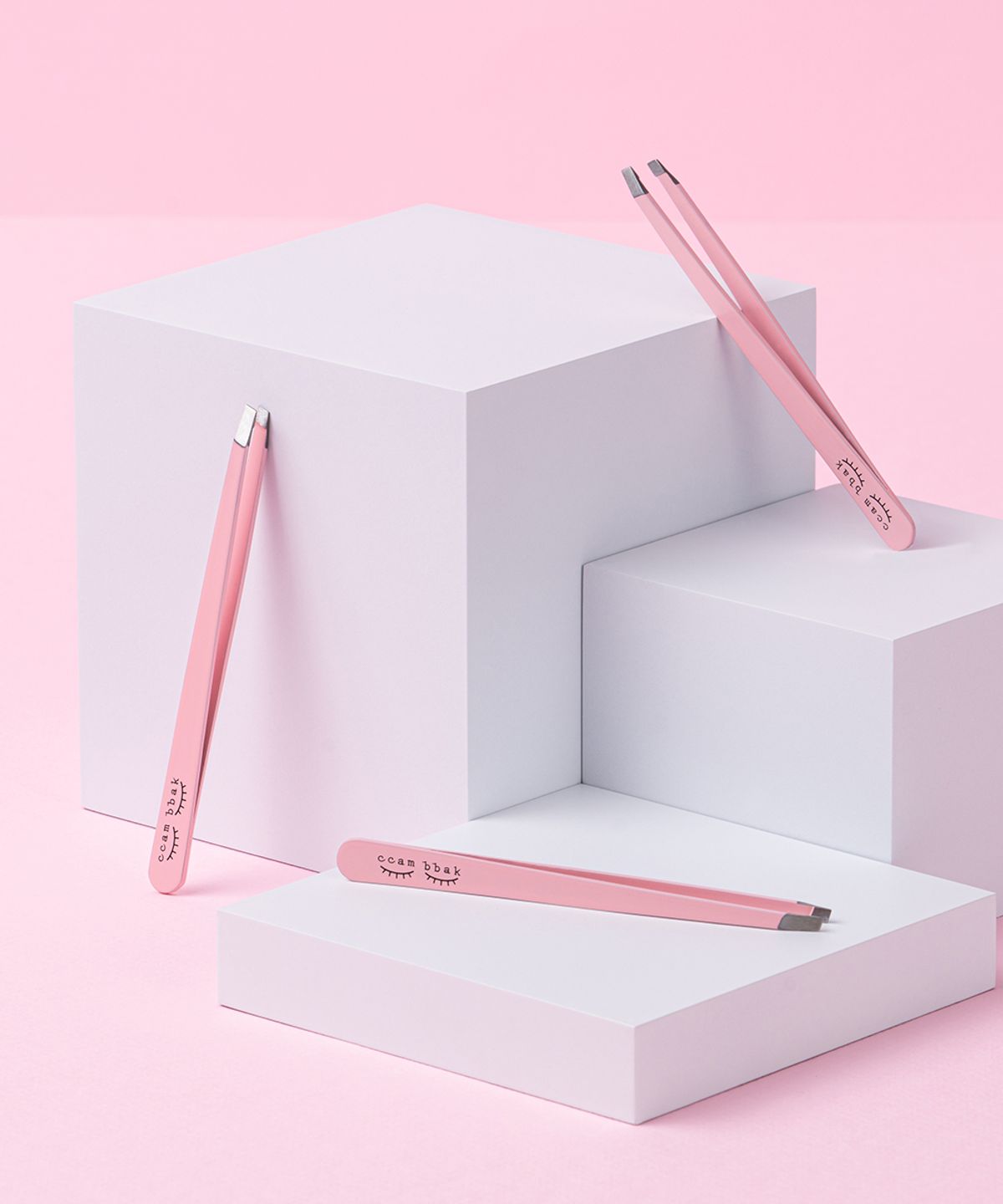 Pink curved tweezers