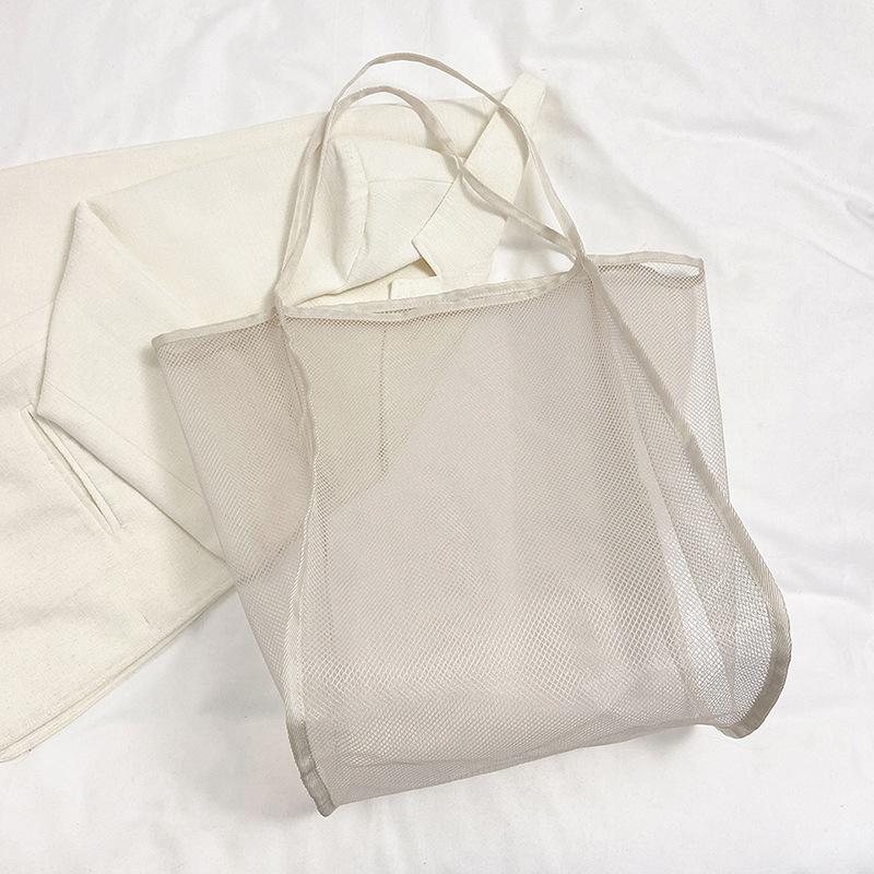 Wiosna 2025 nowa torba na zakupy przezroczysta torba modna na ramię siatkowa torba-wiadro duża pojemność mała świeża torba tote