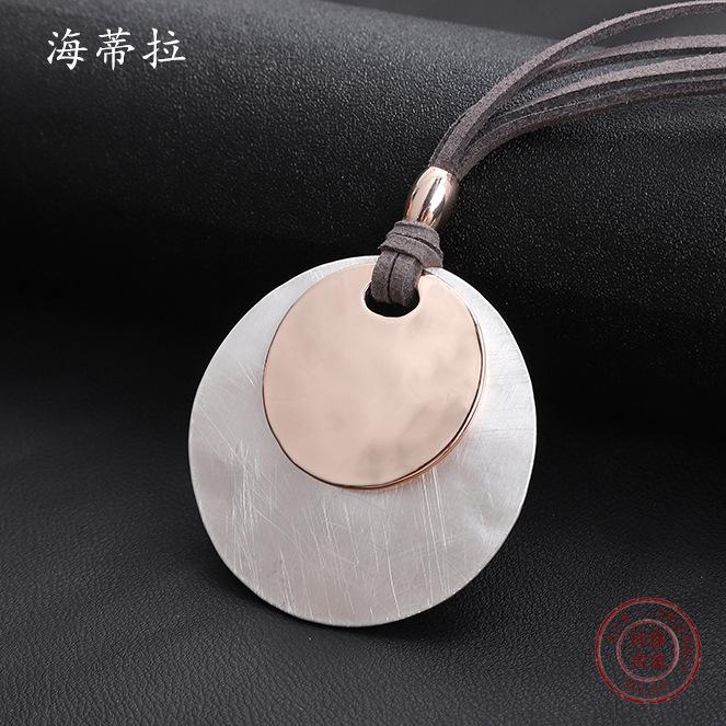 New brushed round alloy pendant, large and small discs stacked with women's premium leather rope sweater chain.