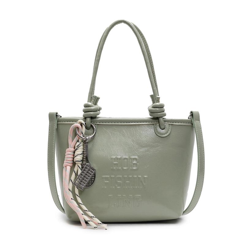 2025 popular new niche simple wind hand carrying bucket bag Korean version casual versatile commuter fashion messenger bag women