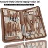 28-teiliges Edelstahl-Nagelpflege-Set: Enthält Nagelscheren, Nagelhautzangen, Pediküre-Werkzeuge, einen Augenbrauentrimmer und eine Pinzette in einem braunen Etui.