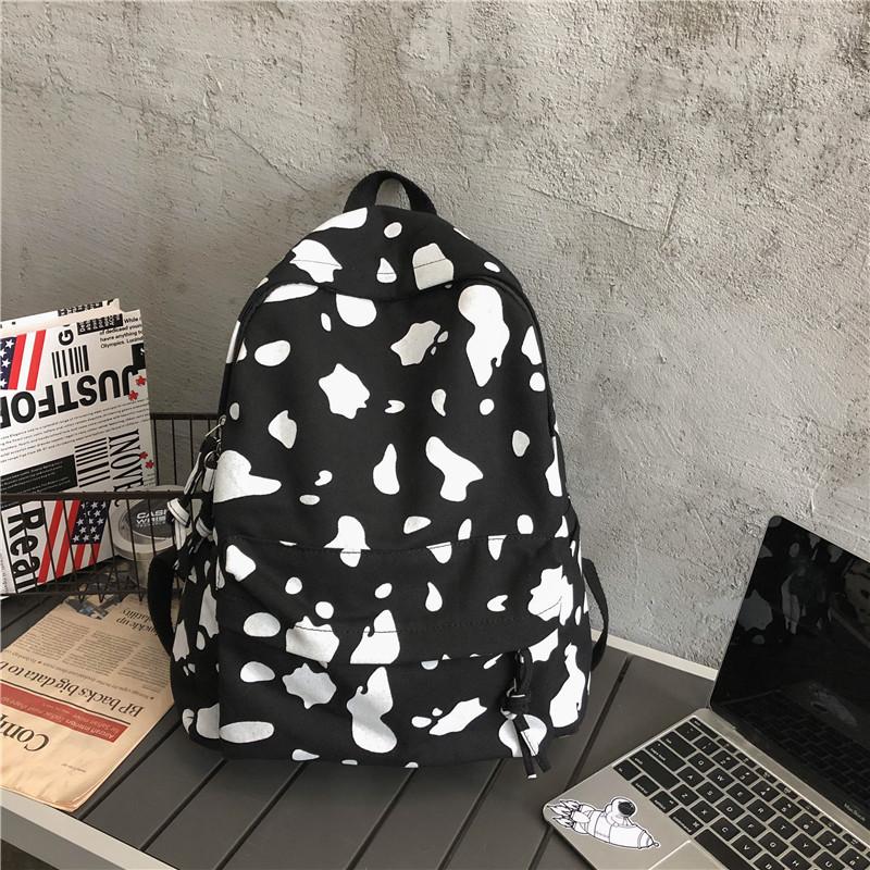 Schoolbag female Korean version Harajuku ulzzang Mori girl canvas backpack ins fire cow pattern backpack
