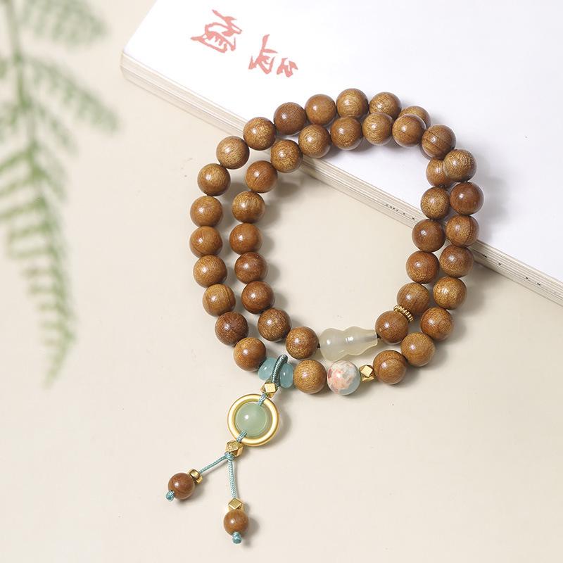 Armband aus goldenem Sandelholzperlen mit Quaste: Unisex Multi-Wrap Rosenkranz im alten chinesischen Stil.