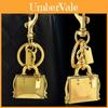Metallic Keychain Bag Charm With Engraved Book Pattern For Fashion Accessories