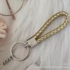 Gevlochten Lederen Touw Sleutelhanger met Poppenhanger - Modieus en Creatief Accessoire
