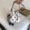 Versatile niche design polka dot drawstring bucket bag women's new commuter bag single shoulder messenger bag