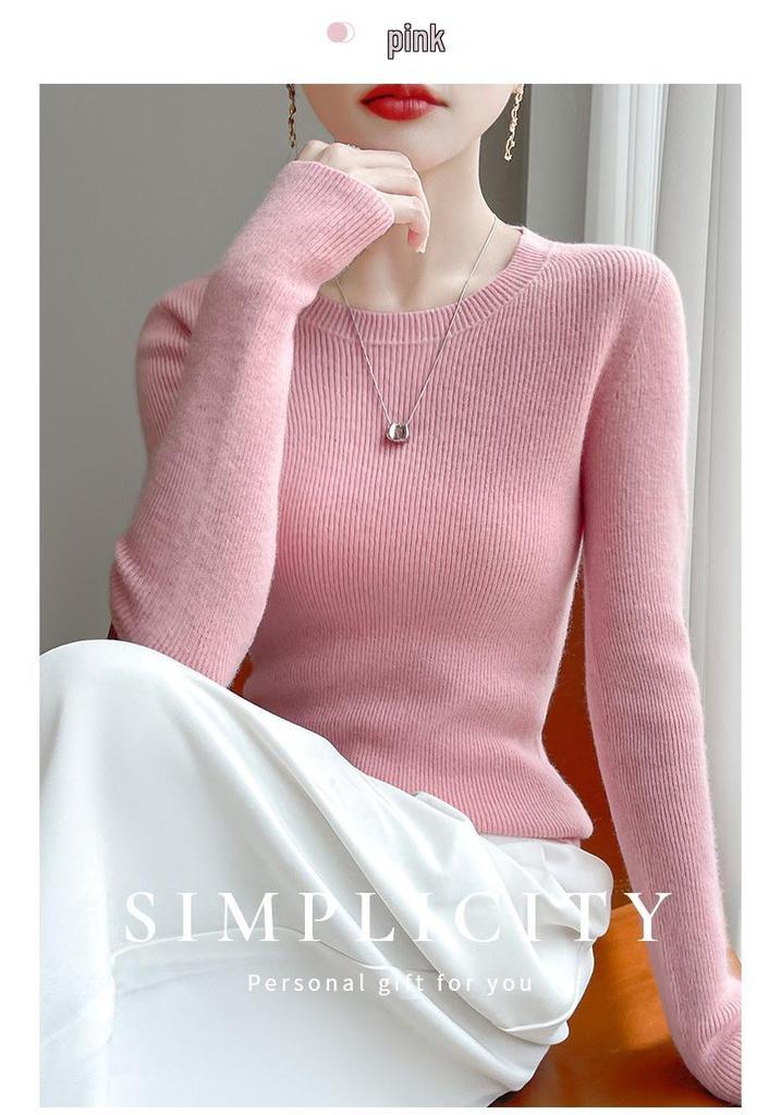 Round Neck Loose Fit Sweater with Seamless Knitting Technology - Comfortable and Slimming Design.
