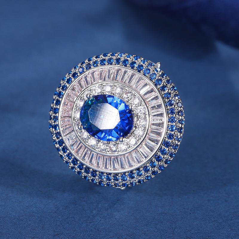 

Ювелирные изделия Медь Позолоченная Имитация цвета Сокровище Королевский сапфир Блеск Инкрустированный бриллиантами Женский комплект подвесок 8 * 10