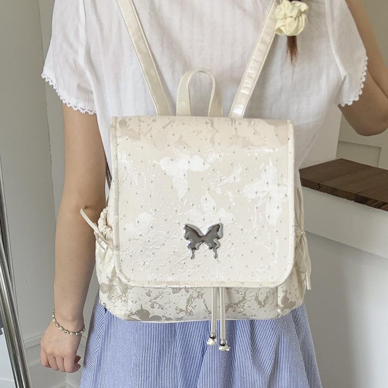 2025 new trendy silver butterfly backpack bag, student class backpack, hand-held travel bag, high-value bag.