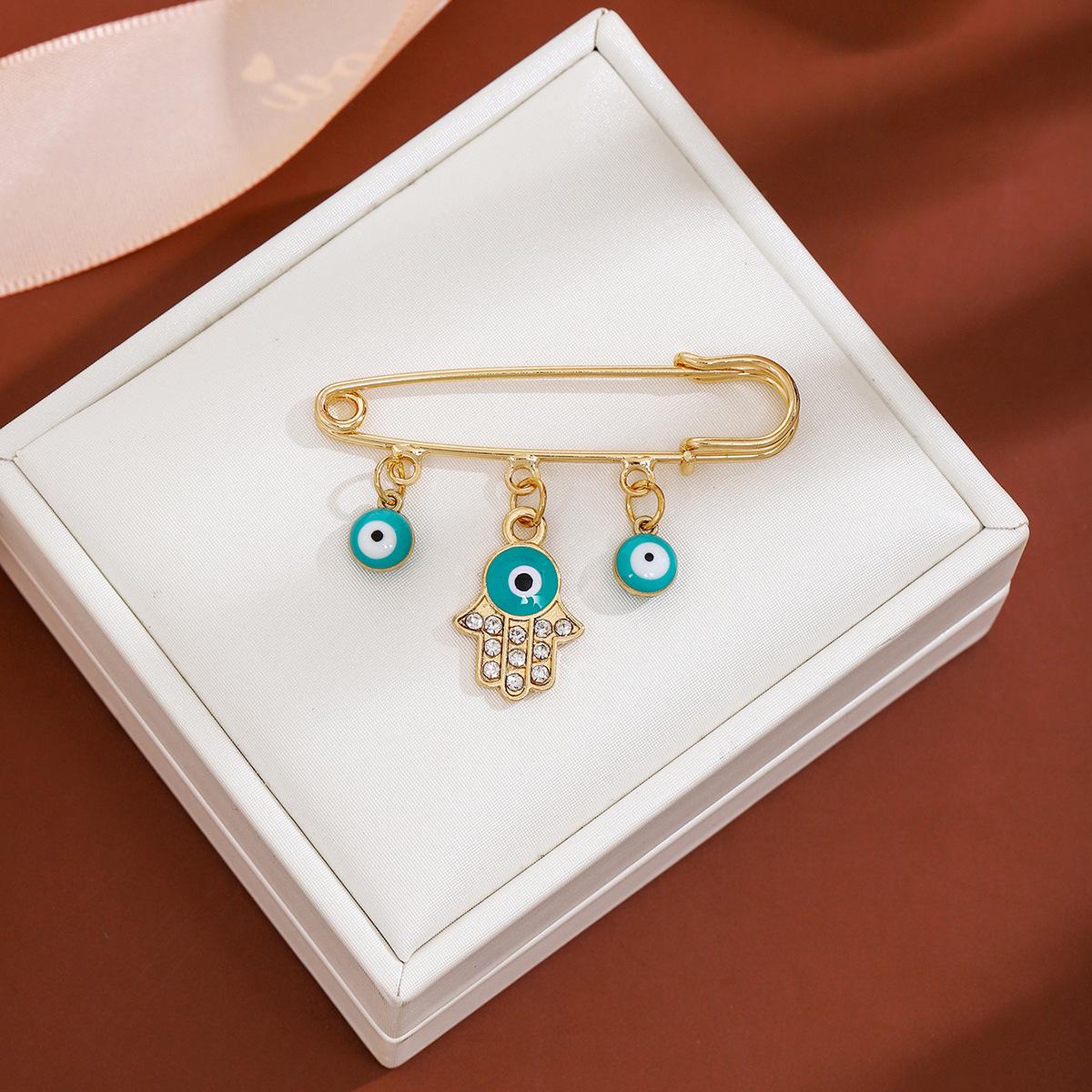 

Брошь-кисточка из синих стразов высокого класса: Европейская и американская брошь-свитер «Глаз дьявола»