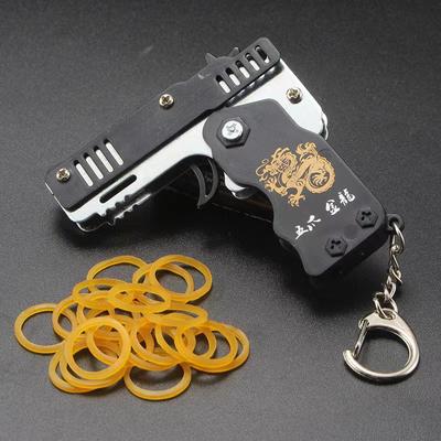 Porte-clés en cuir élastique, 1 pièce, bande de caoutchouc, pistolet de tir, fête en plein air pour enfant, cadeaux pliants, jouets Fidget pour petit ami
