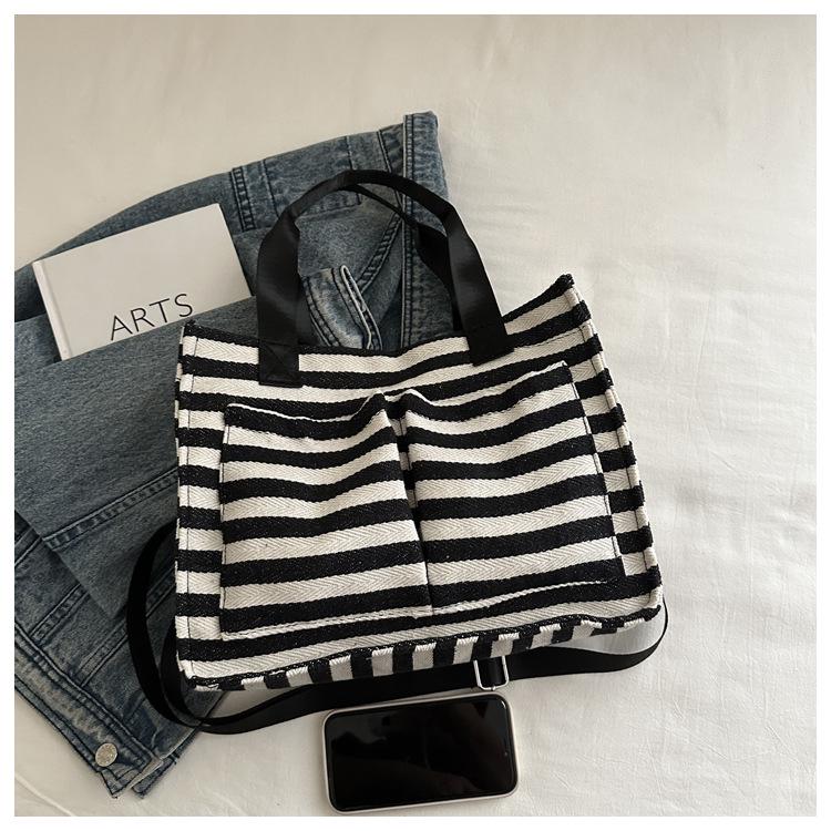 Minimalistische gestreifte Canvas-Tragetasche - Vielseitige Umhängetasche für Frauen, Studentinnen und den lässigen Pendelverkehr