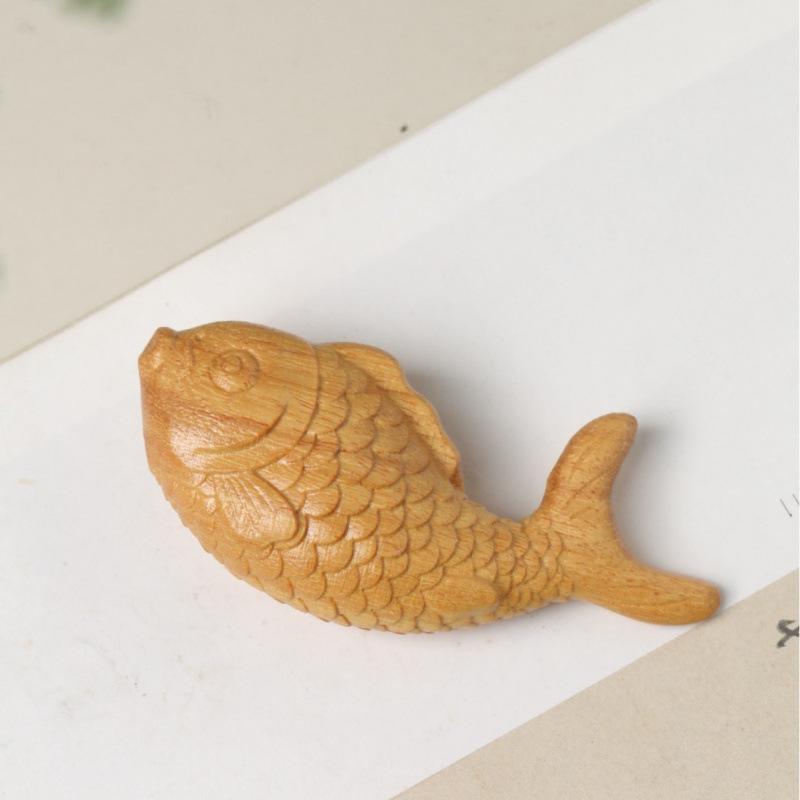 **Cute Koi Fish Carving (Yai Bai Boxwood) - Childlike Handheld Sculpture for Wealth and Fortune**