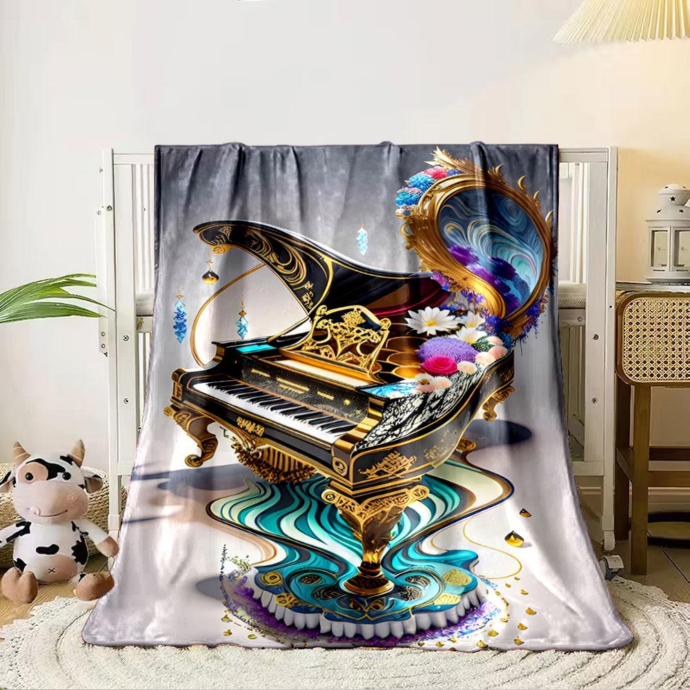 Floral and ornamental piano design with swirling blue and gold accents. for all seasons blanket lunch break throw gift 80cm x 120cm