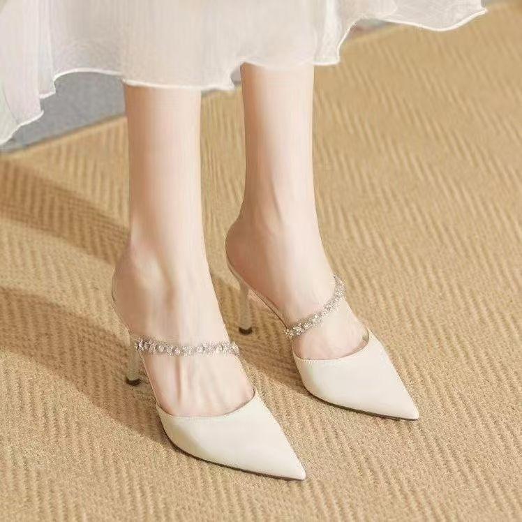 In the summer of 2025, the new European and American pointed rhinestones with high heels, thin heels, sexy temperament, bag head cool slippers.