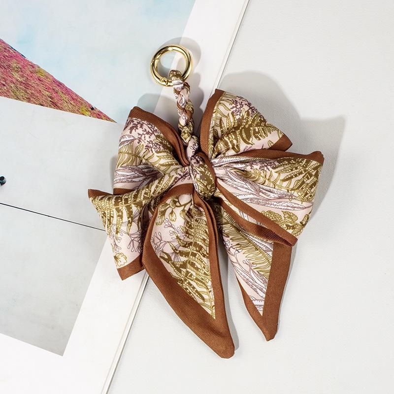 Luxury Bow Chain Bag Charm: Trendy Crossbody Strap and Elegant Pendant Accessory for Influencers