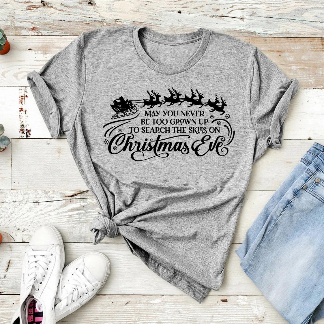 May you never grow up Tshirt funny Christmas shirt retro 90s Christmas Eve holiday Tshirt Santa Claus pattern Womens Tshirt S