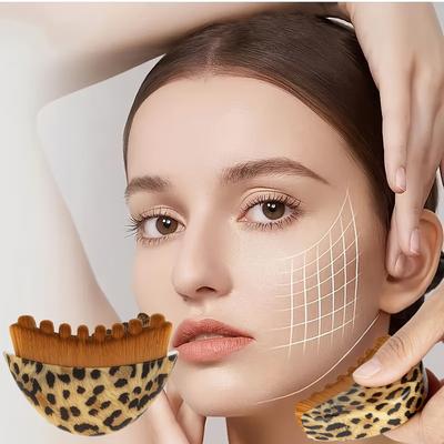A Crescent-shaped Facial Massage Brush with a Contour-hugging Curve. Its Dual-textured Surface, Featuring Soft Bristles On One Side