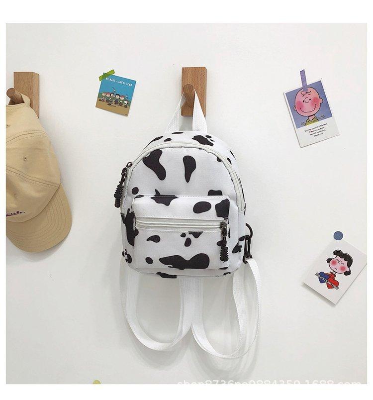 Schoolbag wholesale cow pattern canvas bag female messenger, new versatile ins wind shoulder bag Korean version Mori multi-purpose small backpack